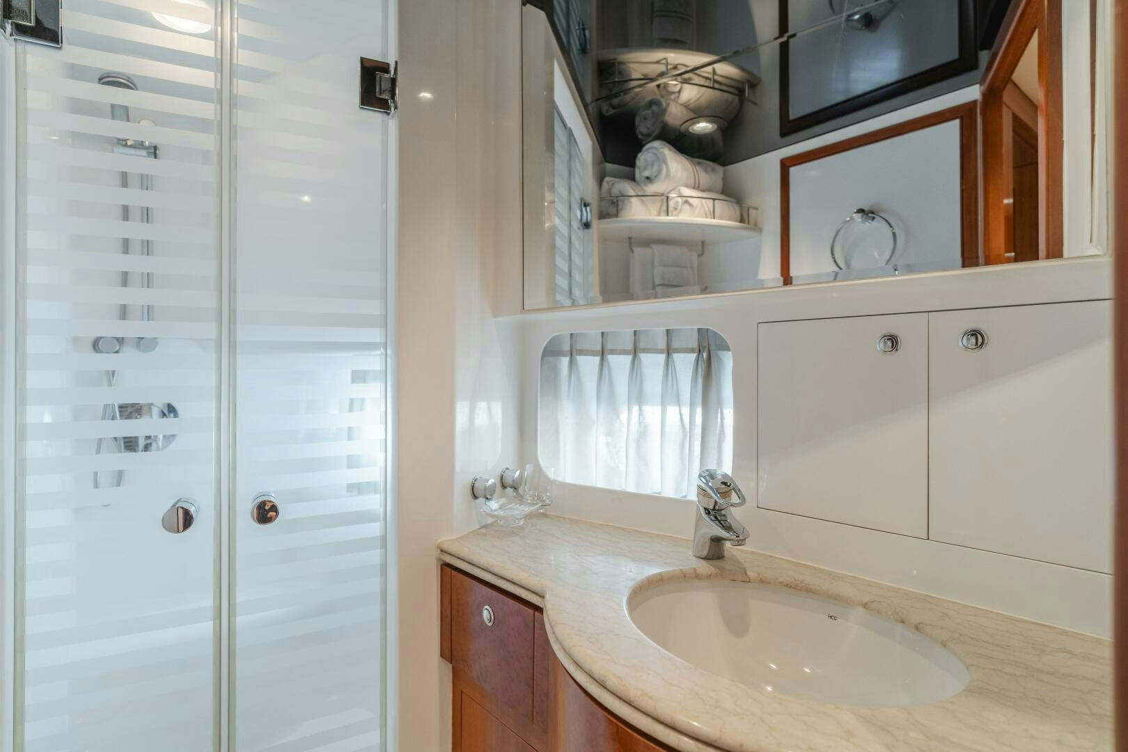 a bathroom with a sink and cabinets aboard LADY LAURA Yacht for Sale