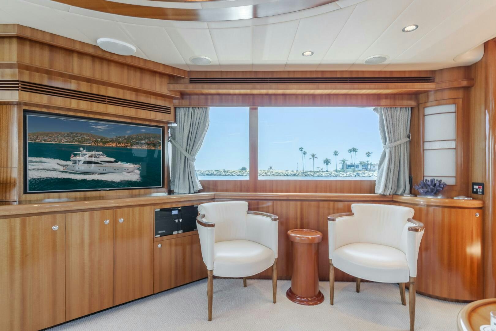 a room with a desk and chairs aboard LADY LAURA Yacht for Sale