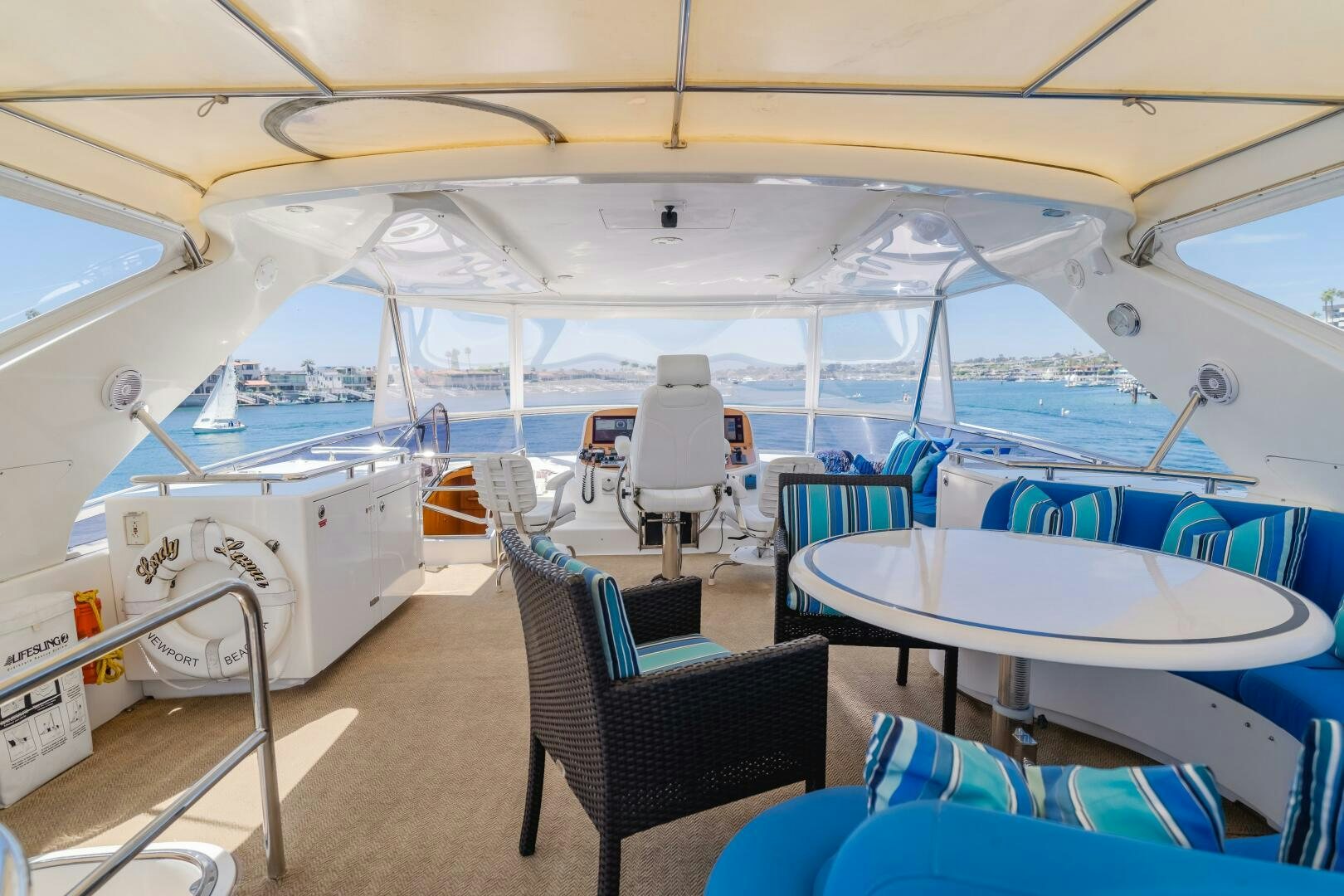 a boat with chairs and tables aboard LADY LAURA Yacht for Sale