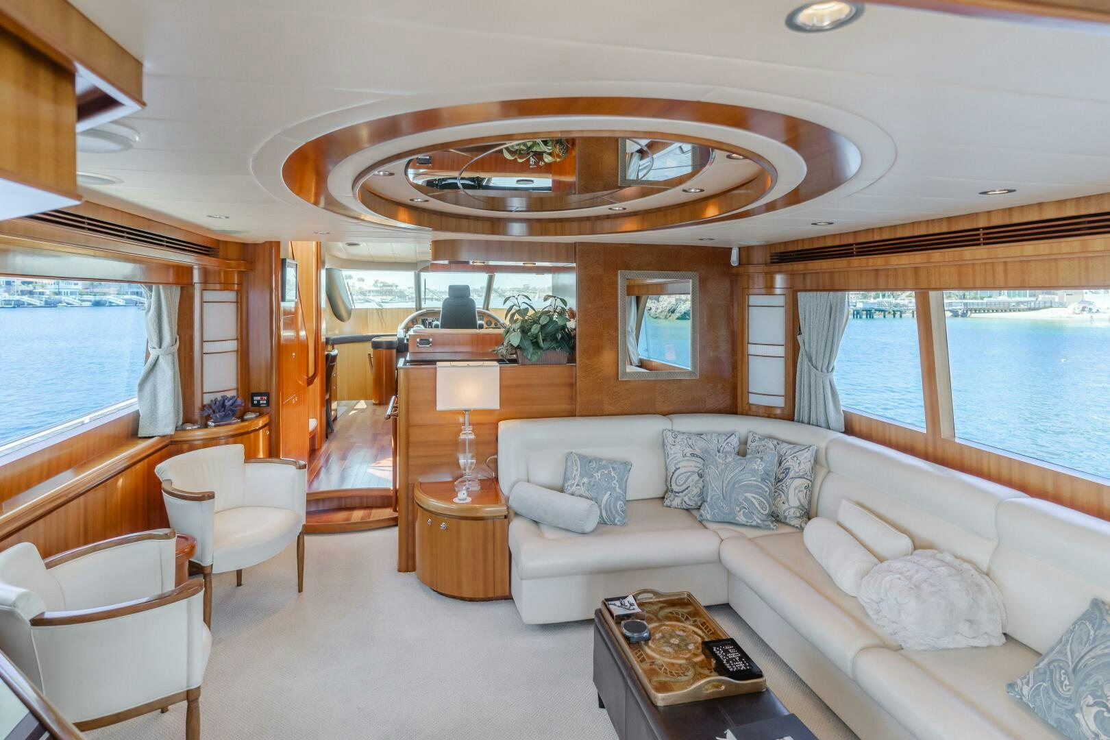 a living room with a large chandelier aboard LADY LAURA Yacht for Sale