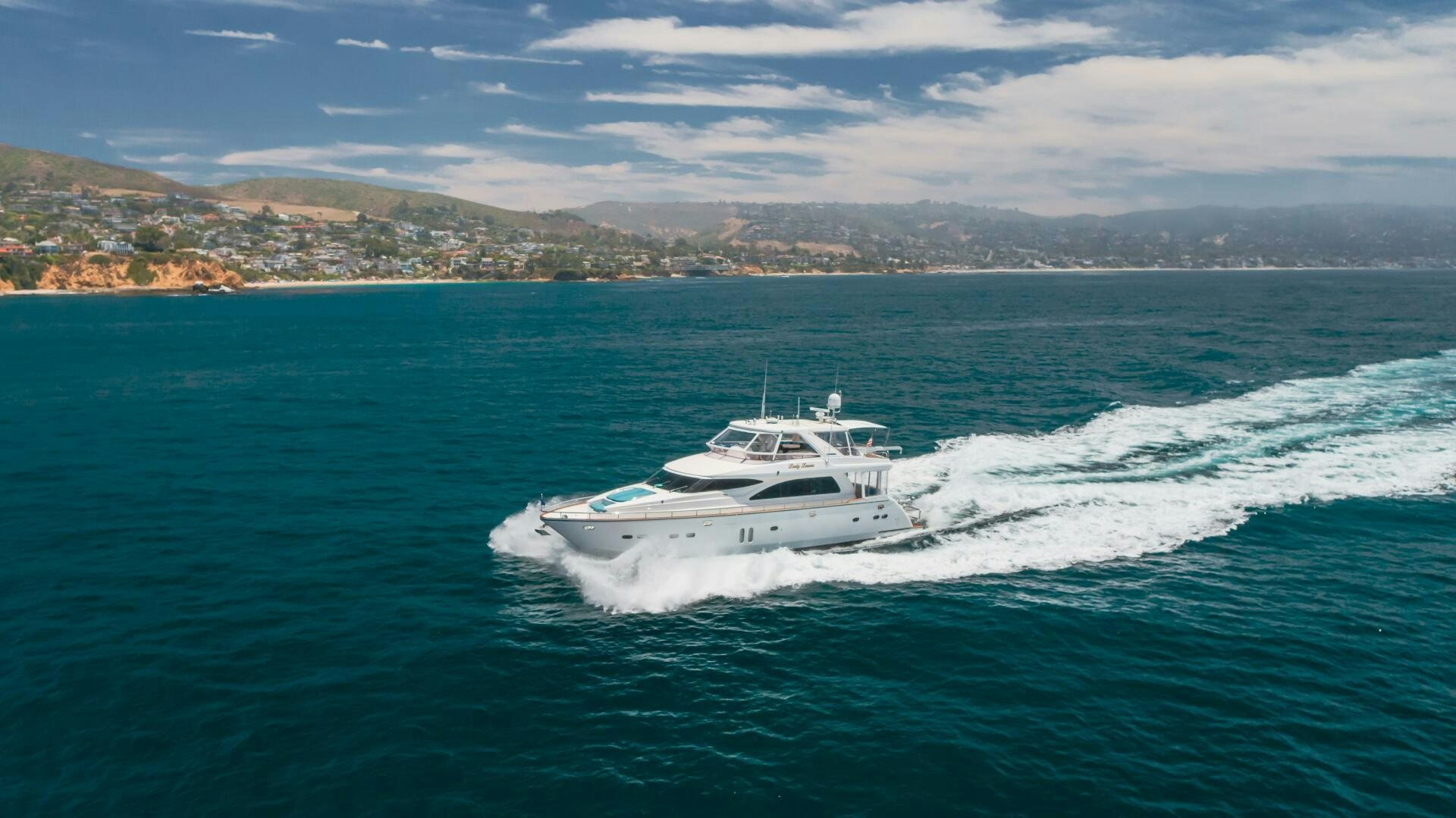 a white boat on the water aboard LADY LAURA Yacht for Sale