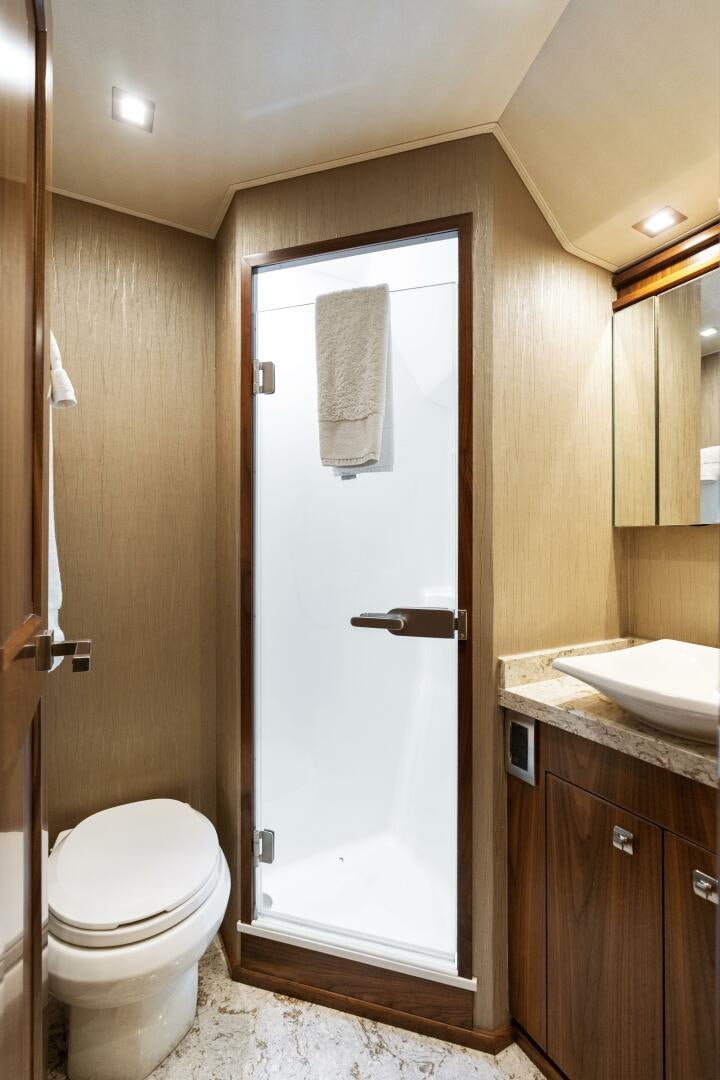 a bathroom with a toilet and sink aboard SOLONIAN Yacht for Sale