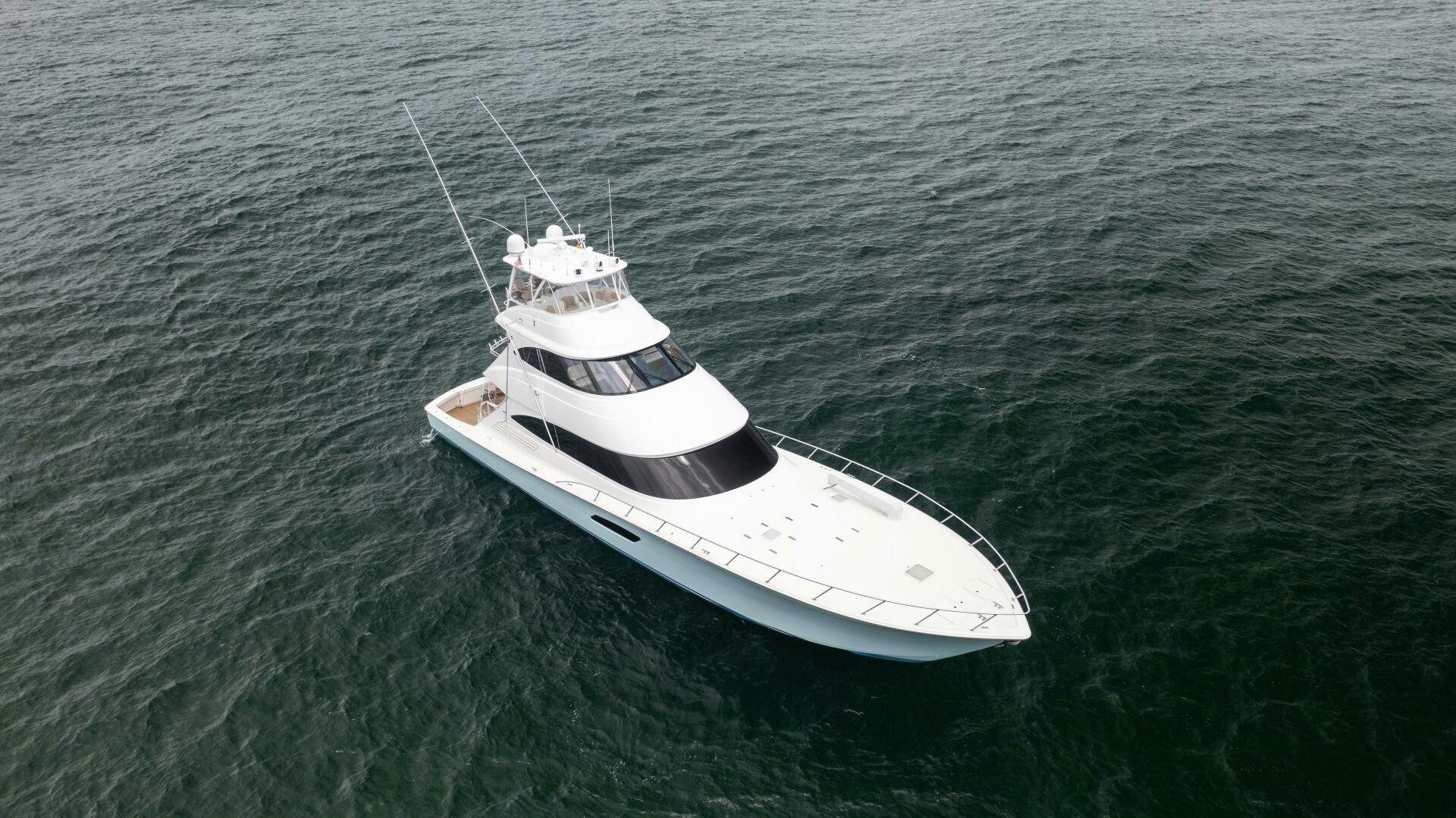 a small white boat in the water aboard SOLONIAN Yacht for Sale