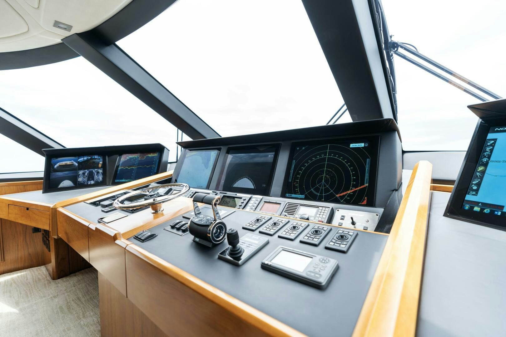 a desk with computers and monitors aboard SOLONIAN Yacht for Sale