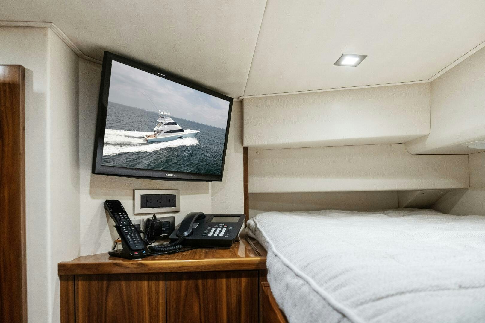 a tv on a wall above a bed aboard SOLONIAN Yacht for Sale