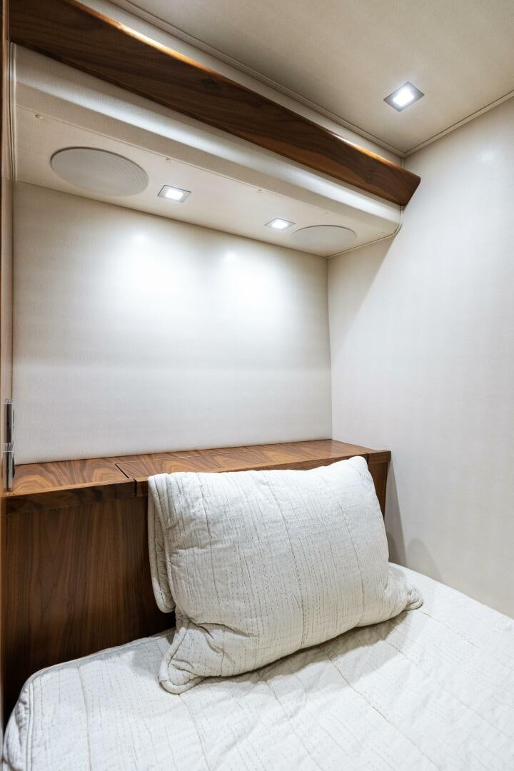 a bed with a white pillow aboard SOLONIAN Yacht for Sale