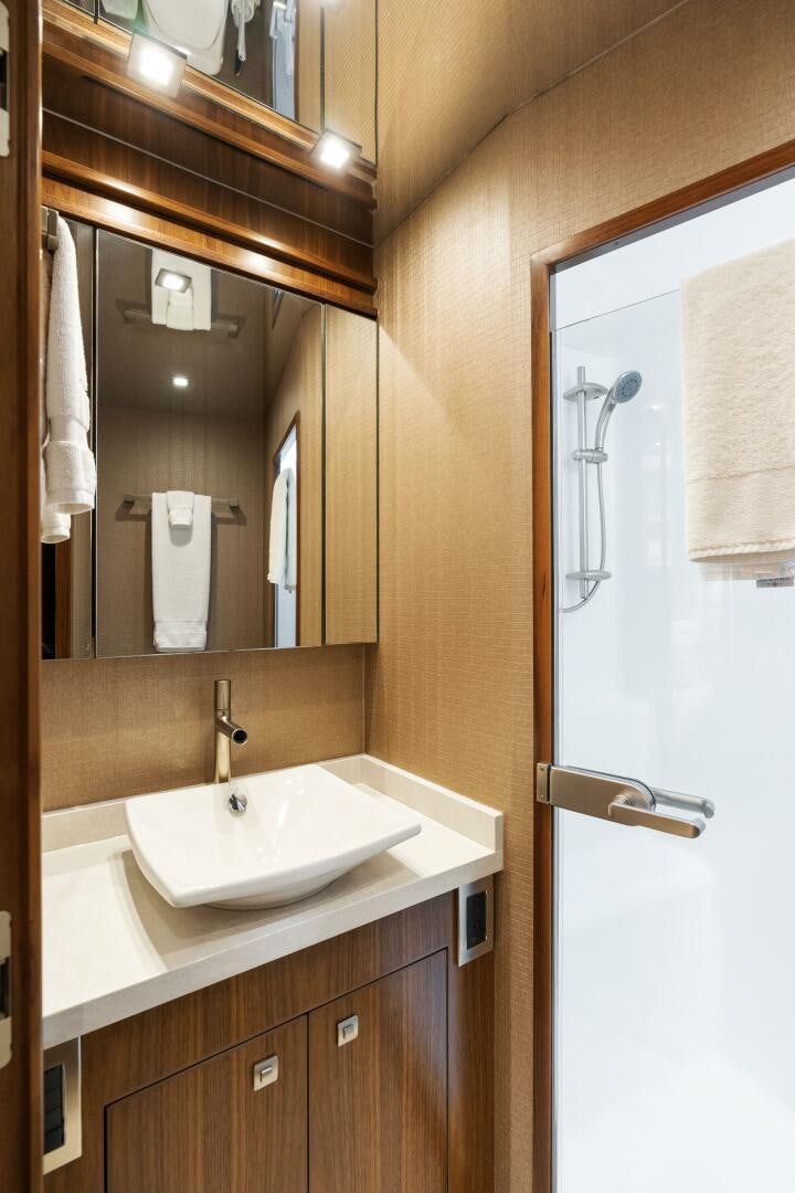 a bathroom with a sink and mirror aboard SOLONIAN Yacht for Sale