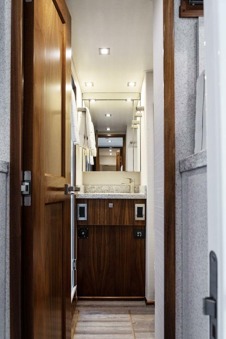 a bathroom with a large mirror aboard SOLONIAN Yacht for Sale