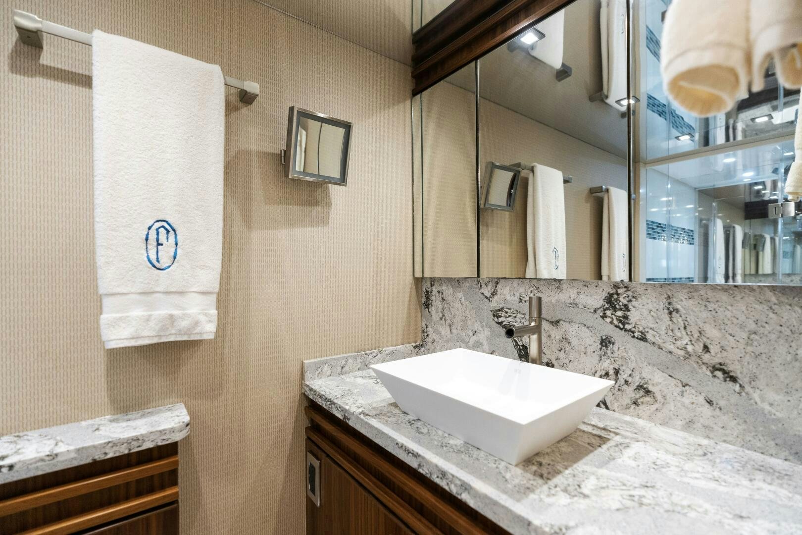 a bathroom with a sink and a mirror aboard SOLONIAN Yacht for Sale