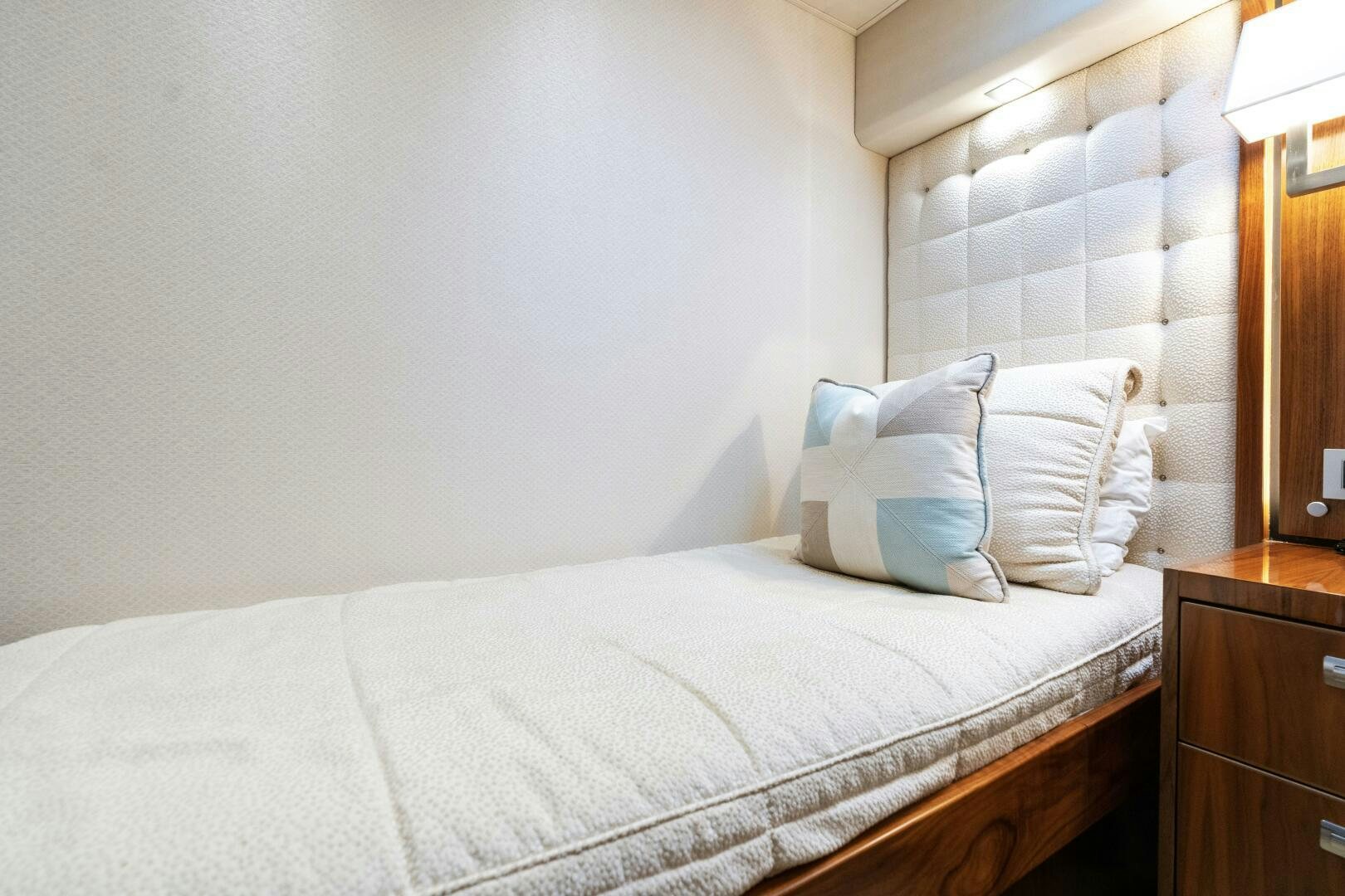 a bed with white sheets aboard SOLONIAN Yacht for Sale