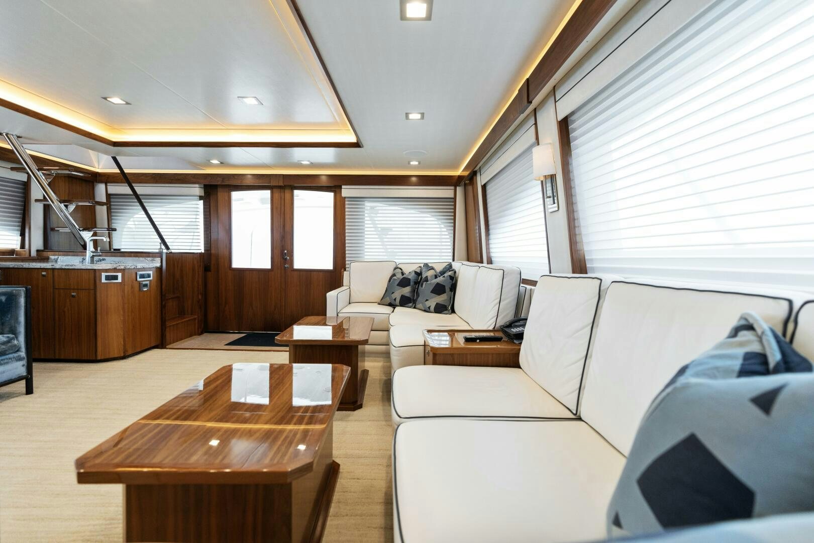 a living room with a couch and a coffee table aboard SOLONIAN Yacht for Sale