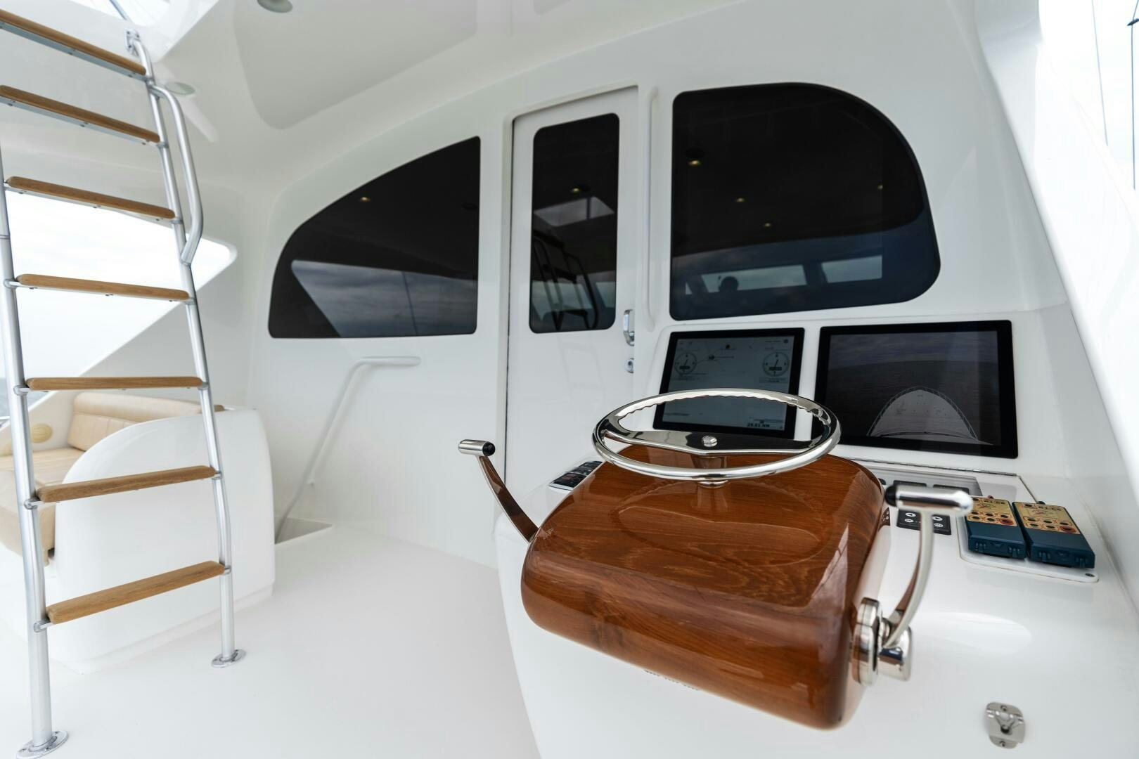 a white vehicle with a black screen aboard SOLONIAN Yacht for Sale