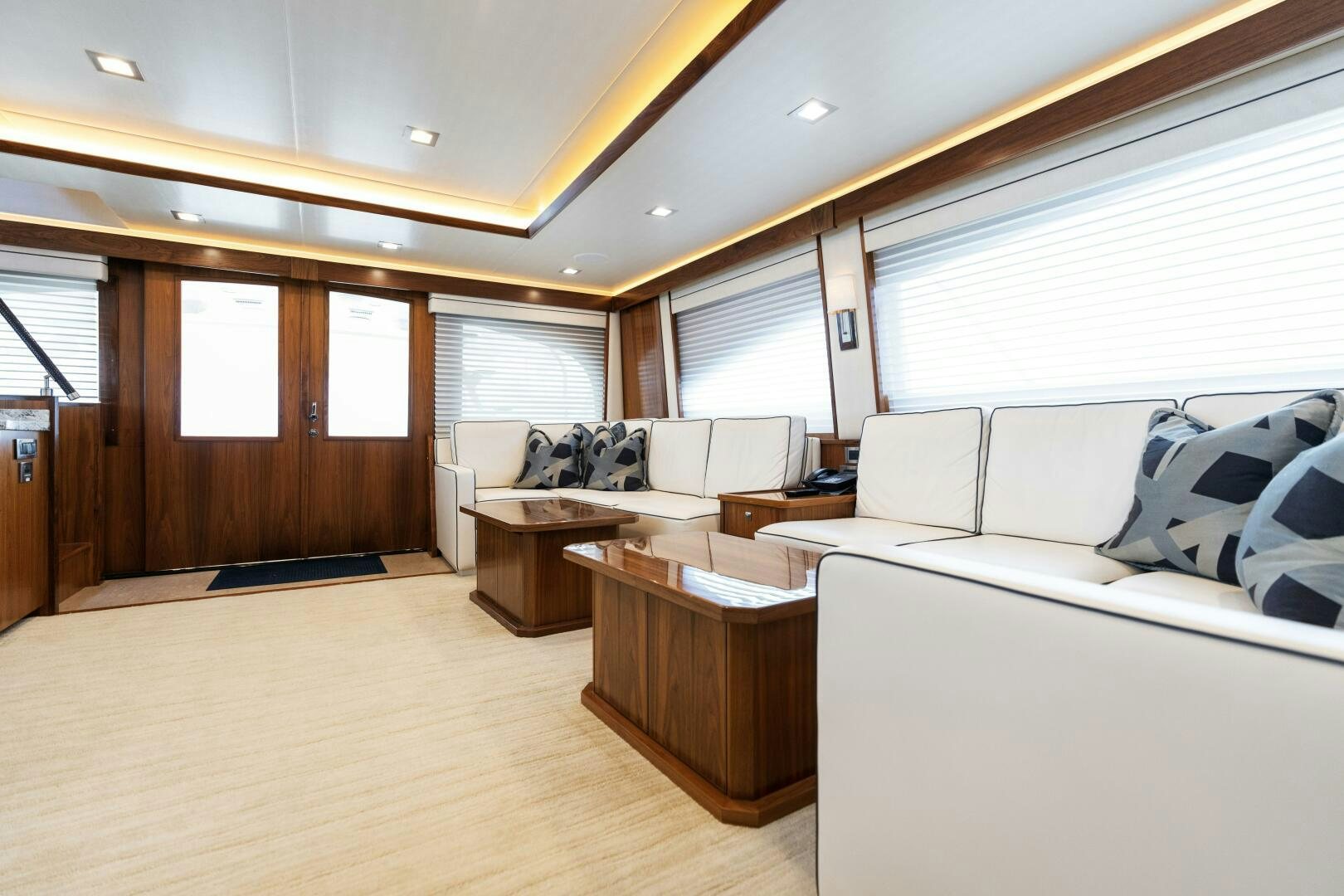 a living room with a couch and a table aboard SOLONIAN Yacht for Sale
