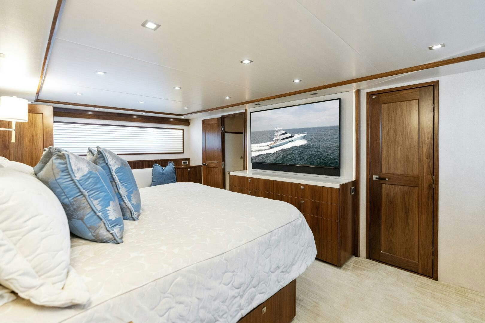 a bedroom with a bed and a television aboard SOLONIAN Yacht for Sale