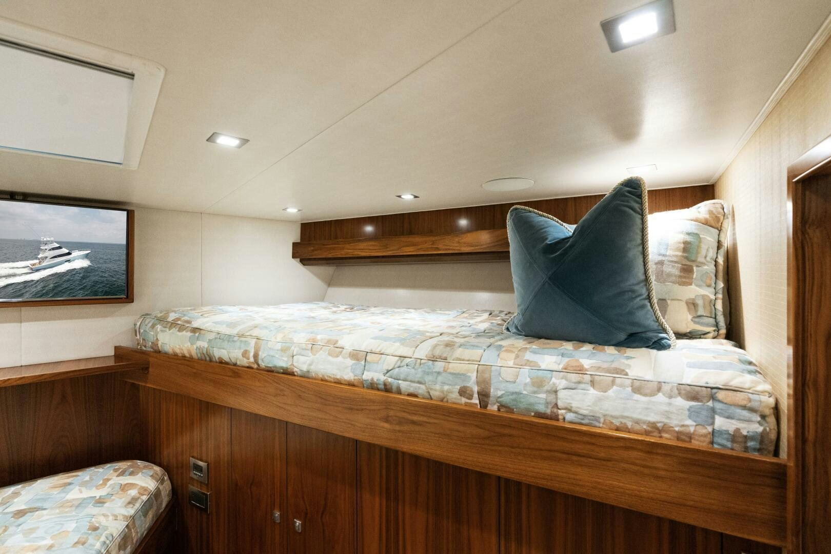 a bed with a wooden headboard aboard SOLONIAN Yacht for Sale