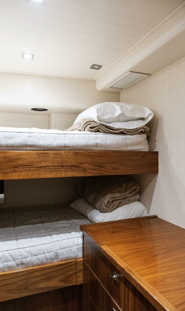 a bed with white sheets aboard SOLONIAN Yacht for Sale