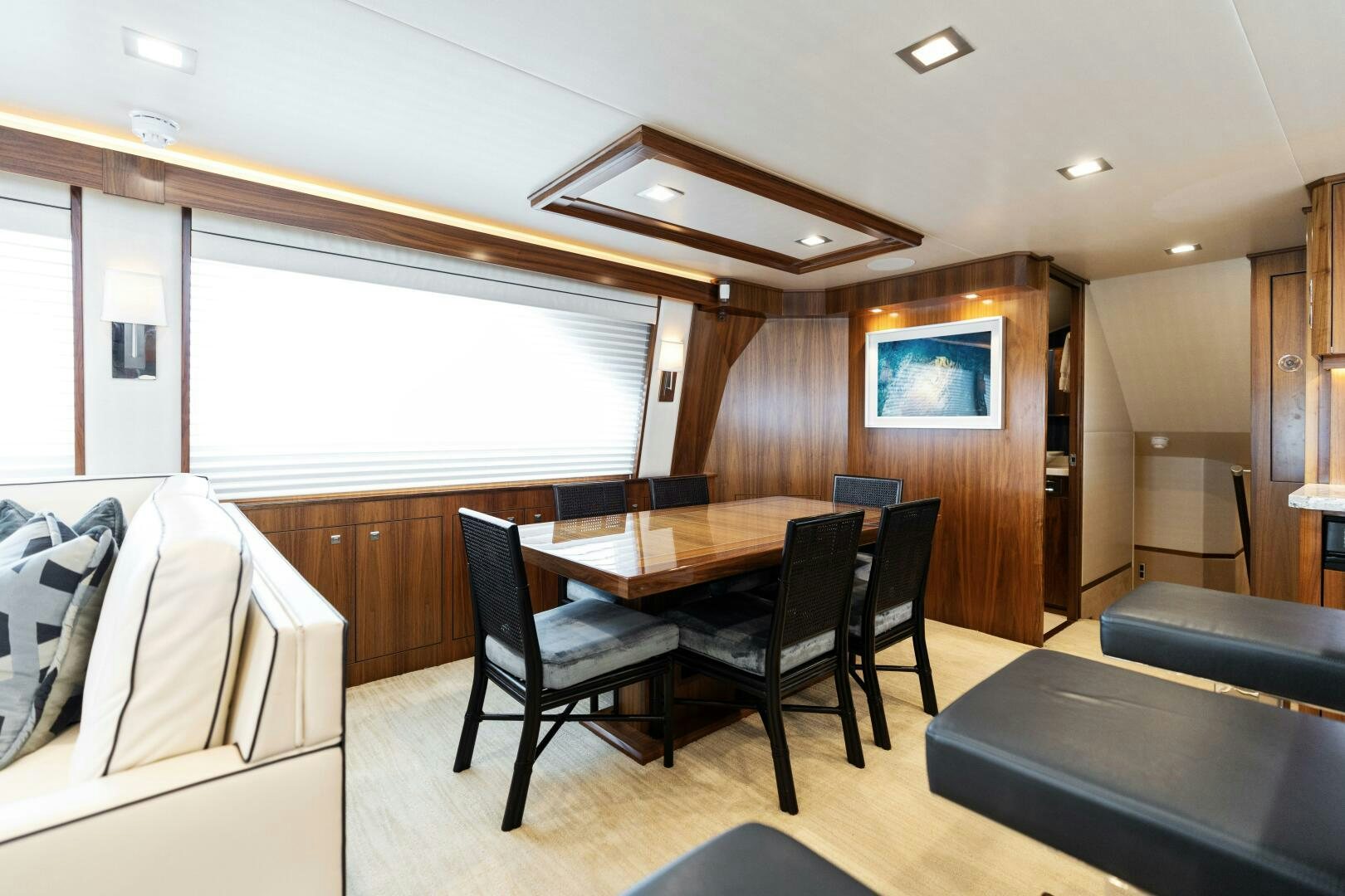 a room with a table and chairs aboard SOLONIAN Yacht for Sale