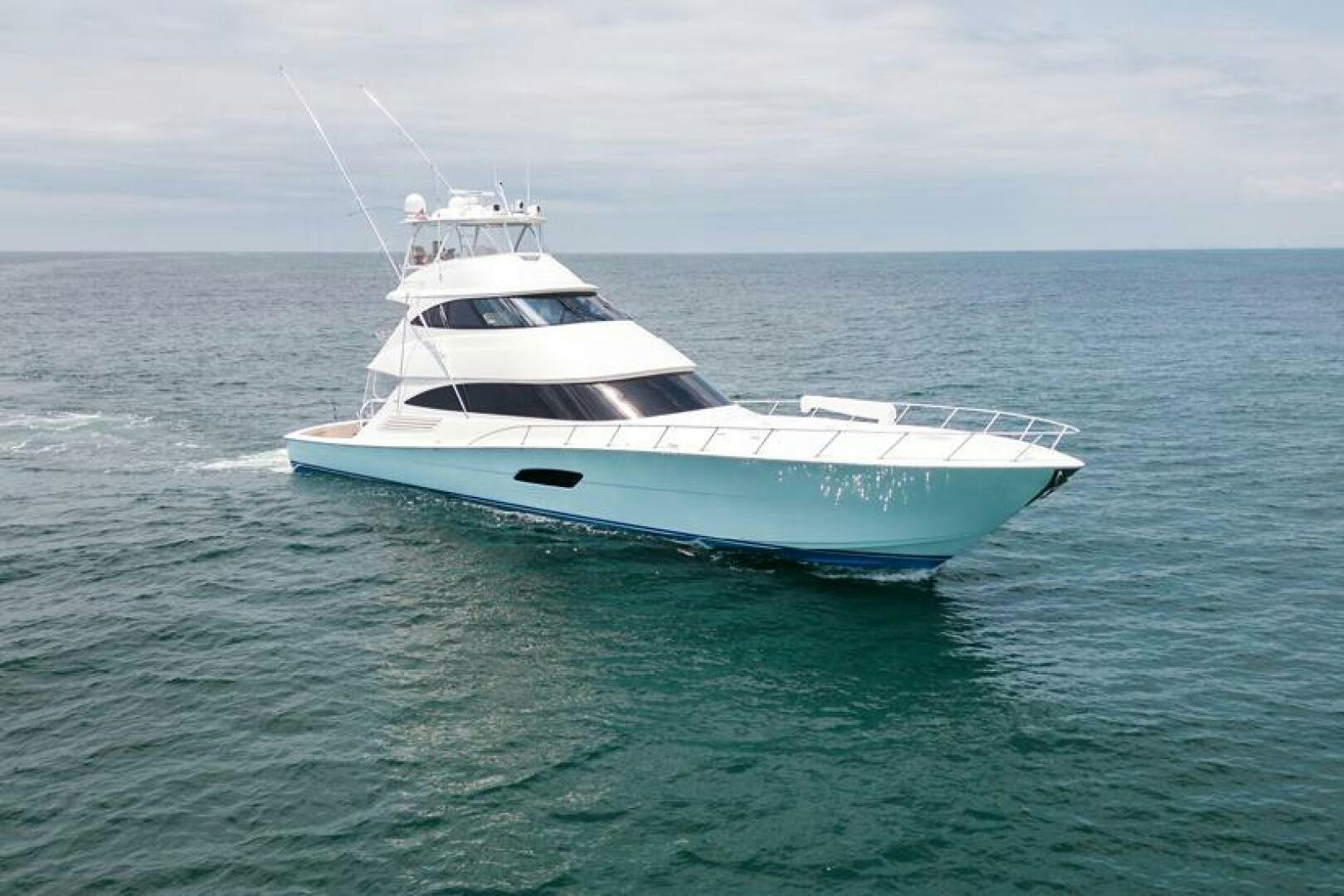 a white yacht in the ocean aboard A WORK OF ART Yacht for Sale