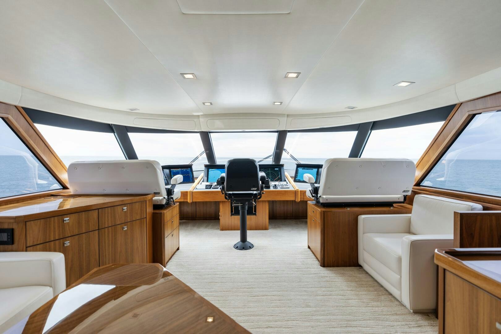 a room with a couch and a desk in it aboard SOLONIAN Yacht for Sale