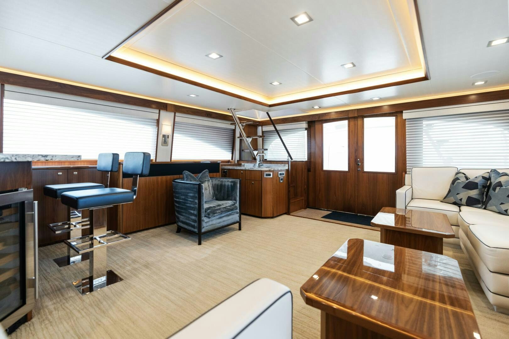 a living room with a wood floor aboard SOLONIAN Yacht for Sale