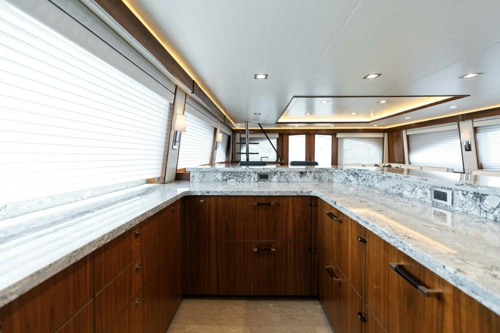 a kitchen with wooden cabinets aboard SOLONIAN Yacht for Sale