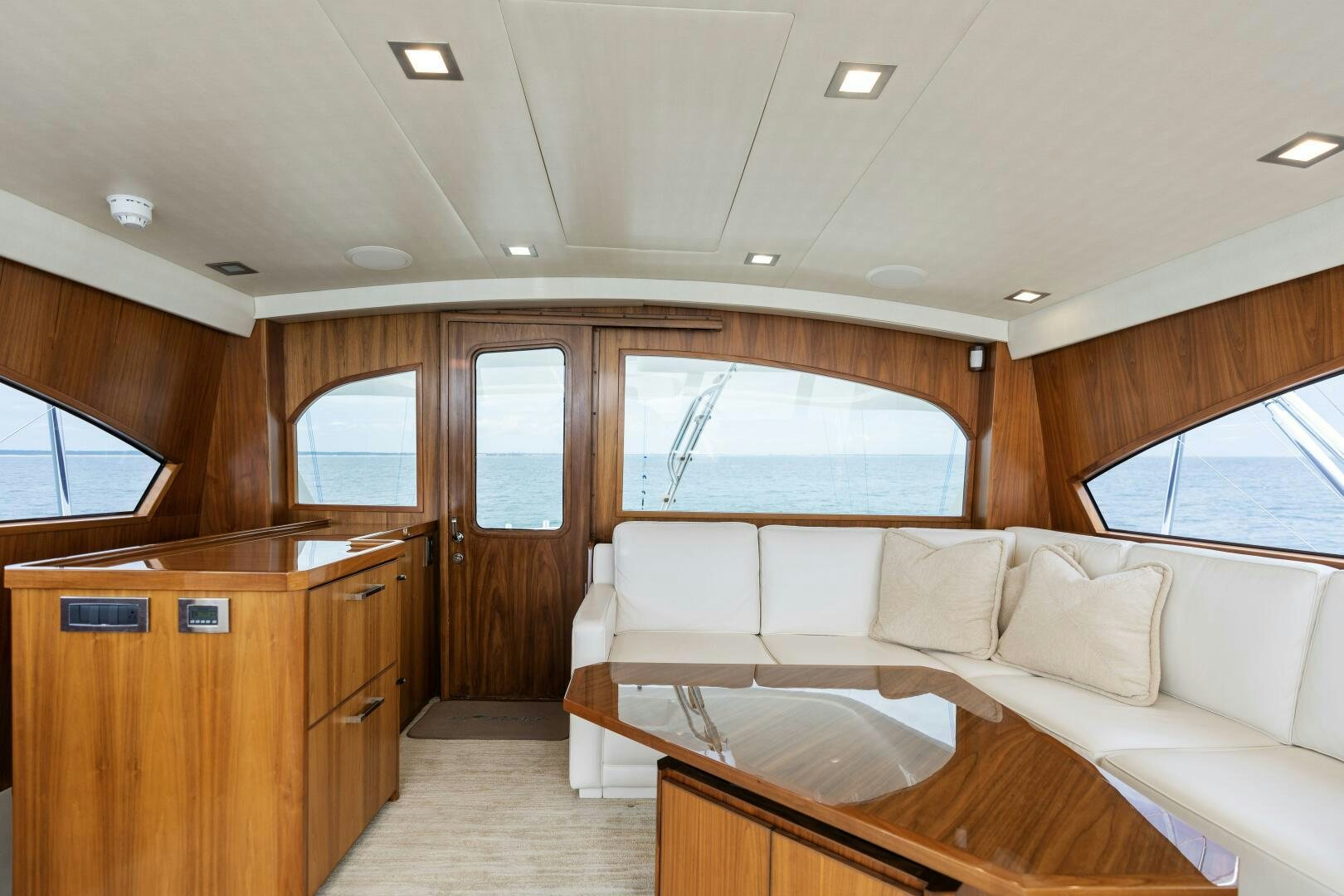 a living room with a couch and a table aboard SOLONIAN Yacht for Sale
