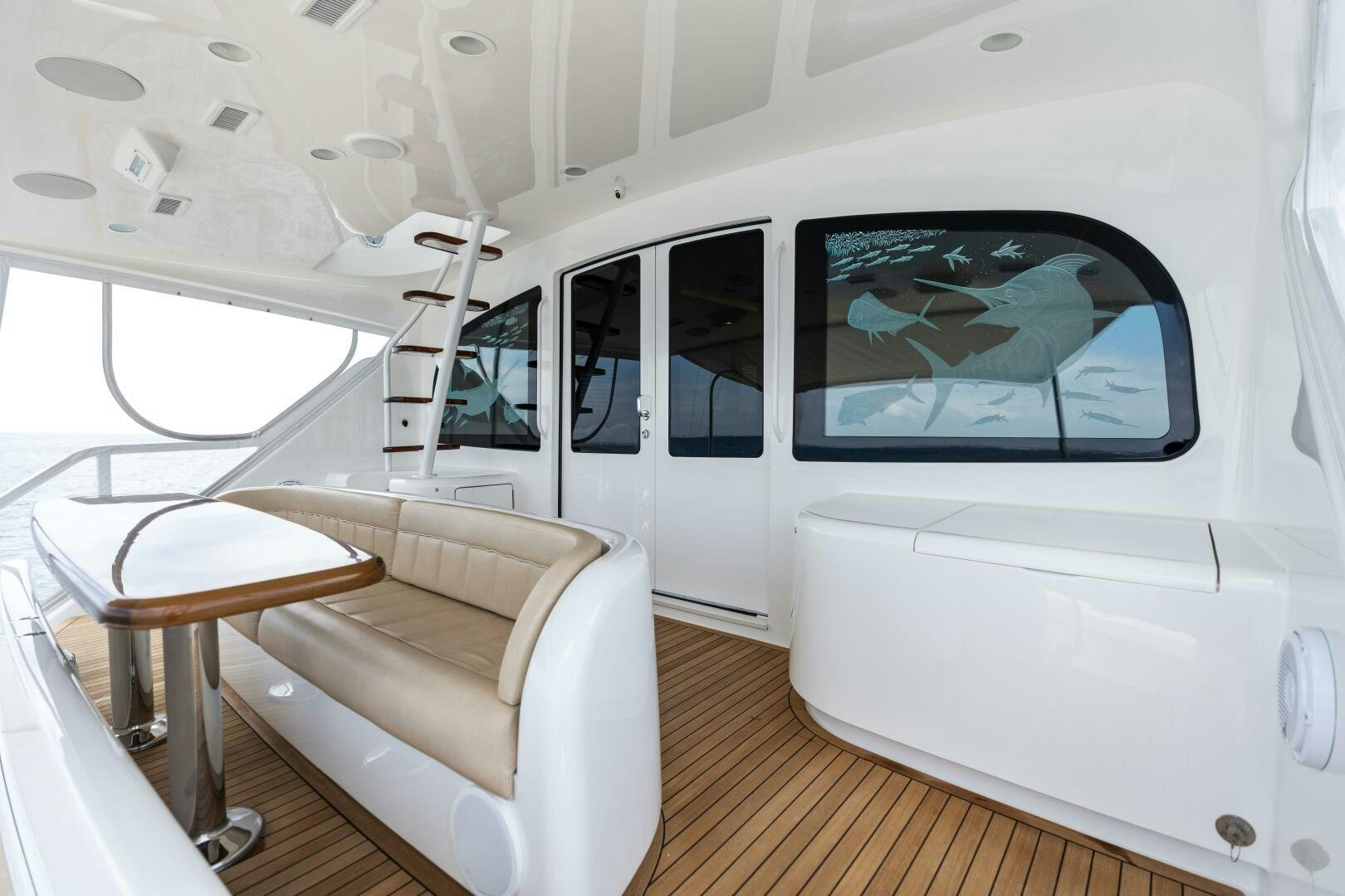 a white room with a couch and a chair aboard SOLONIAN Yacht for Sale