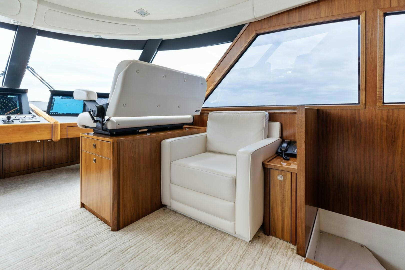 a room with a chair and a desk with a laptop on it aboard SOLONIAN Yacht for Sale