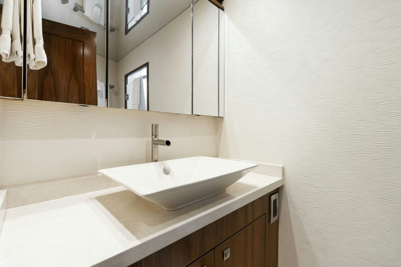 a bathroom with a sink and a mirror aboard SOLONIAN Yacht for Sale