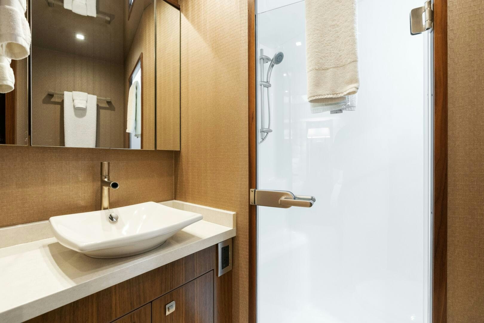 a bathroom with a sink and a mirror aboard SOLONIAN Yacht for Sale
