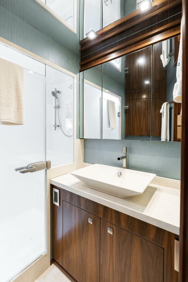 a bathroom with a large mirror aboard SOLONIAN Yacht for Sale