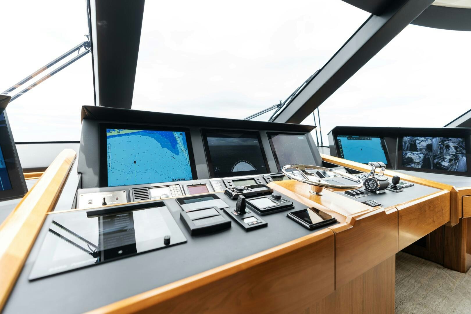 a desk with computers and other electronics aboard SOLONIAN Yacht for Sale