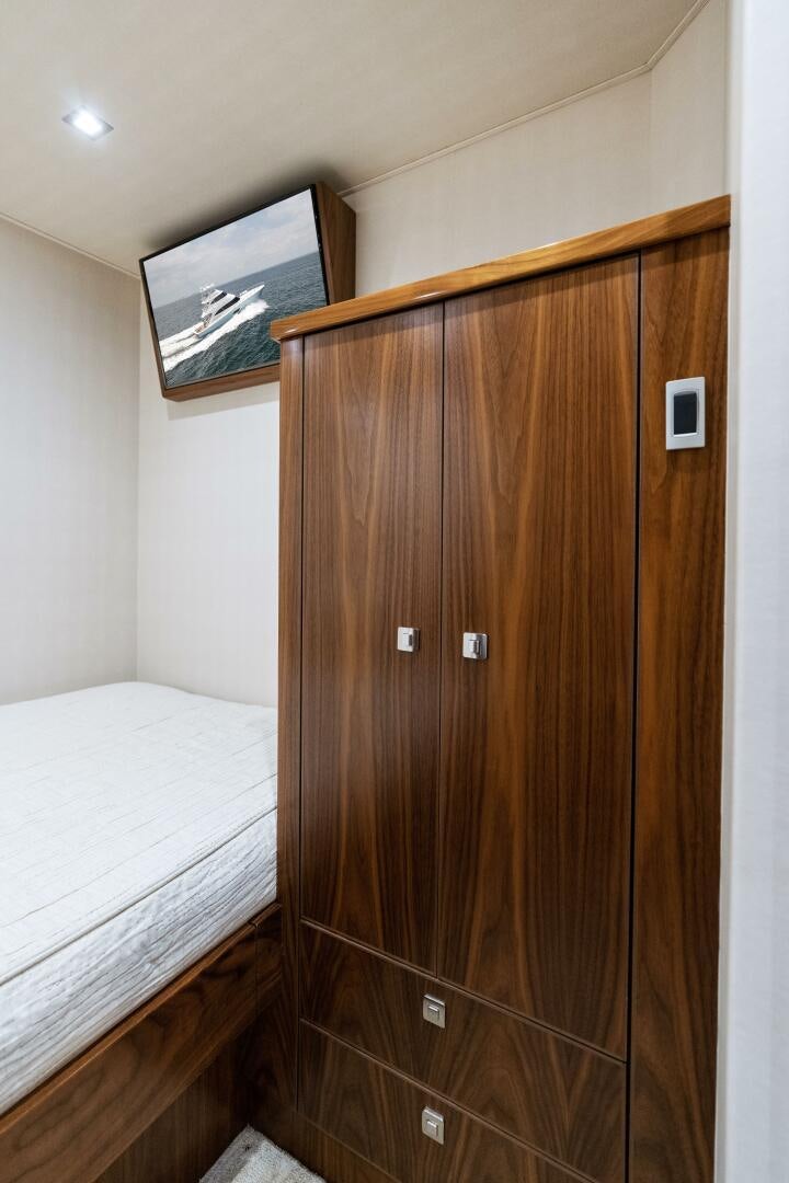 a wooden wardrobe in a room aboard SOLONIAN Yacht for Sale