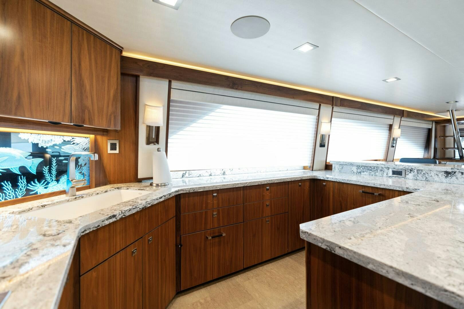 a kitchen with wooden cabinets aboard SOLONIAN Yacht for Sale