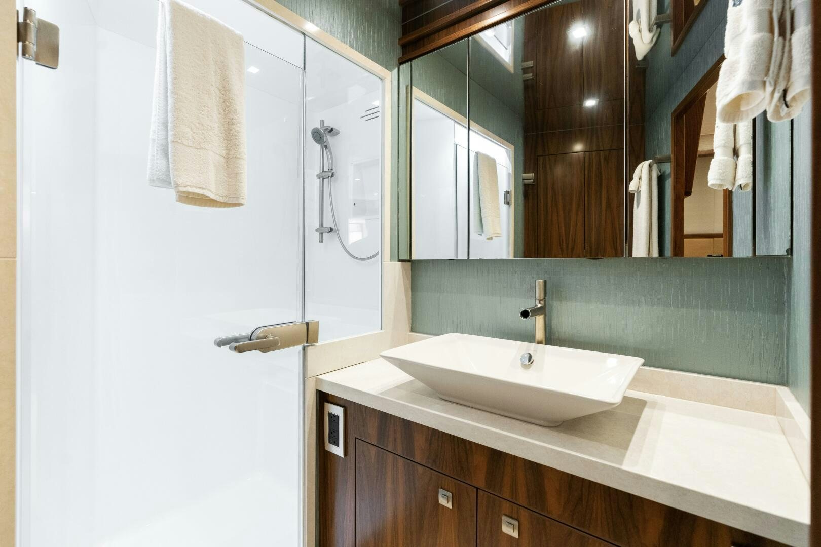 a bathroom with a mirror and a sink aboard SOLONIAN Yacht for Sale