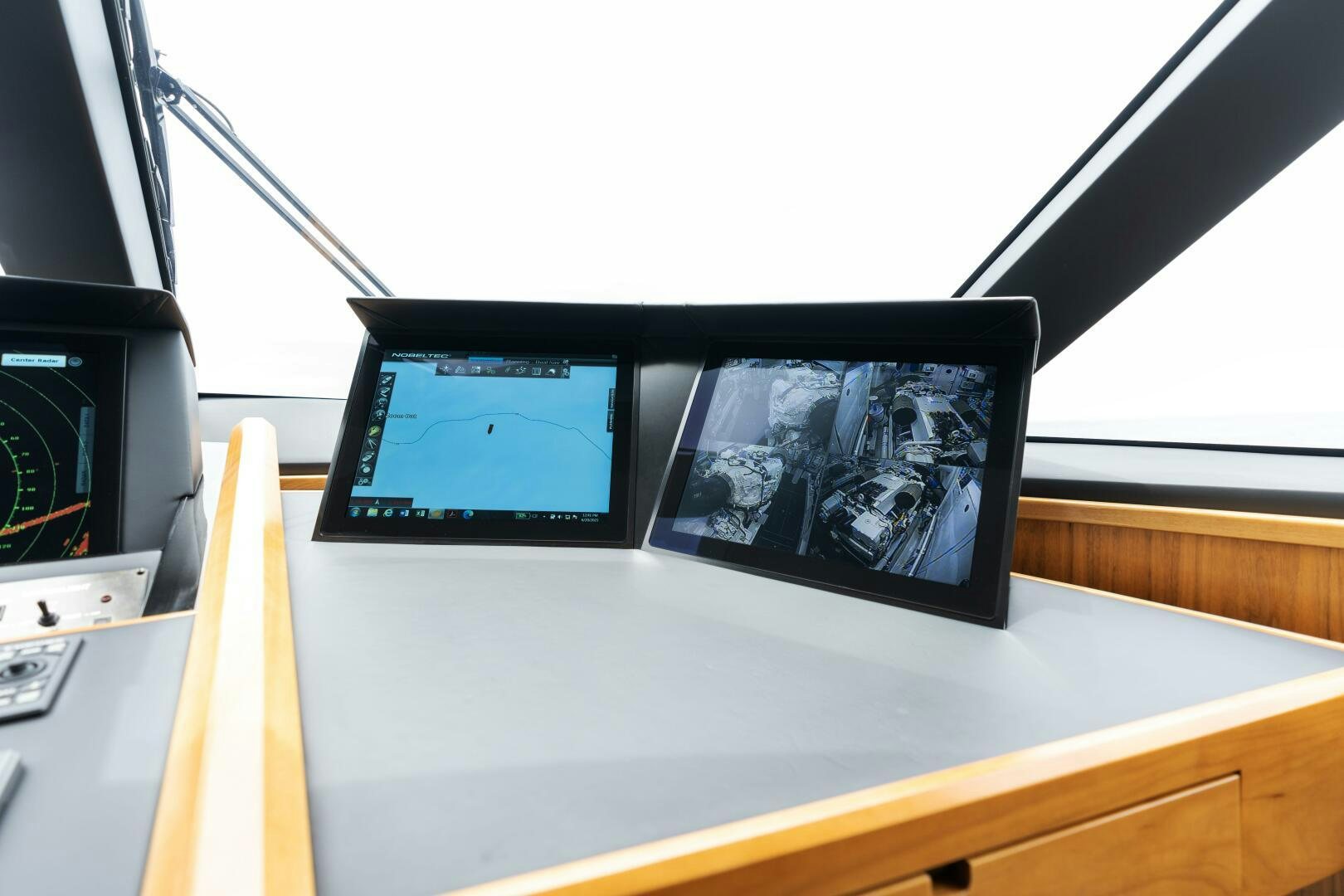 a couple of monitors on a table aboard SOLONIAN Yacht for Sale