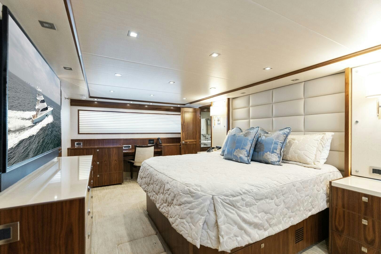a bedroom with a large window aboard SOLONIAN Yacht for Sale
