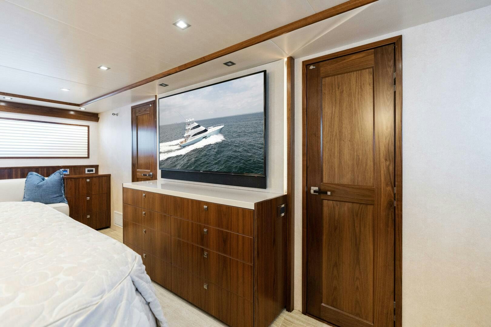 a bedroom with a large tv aboard SOLONIAN Yacht for Sale