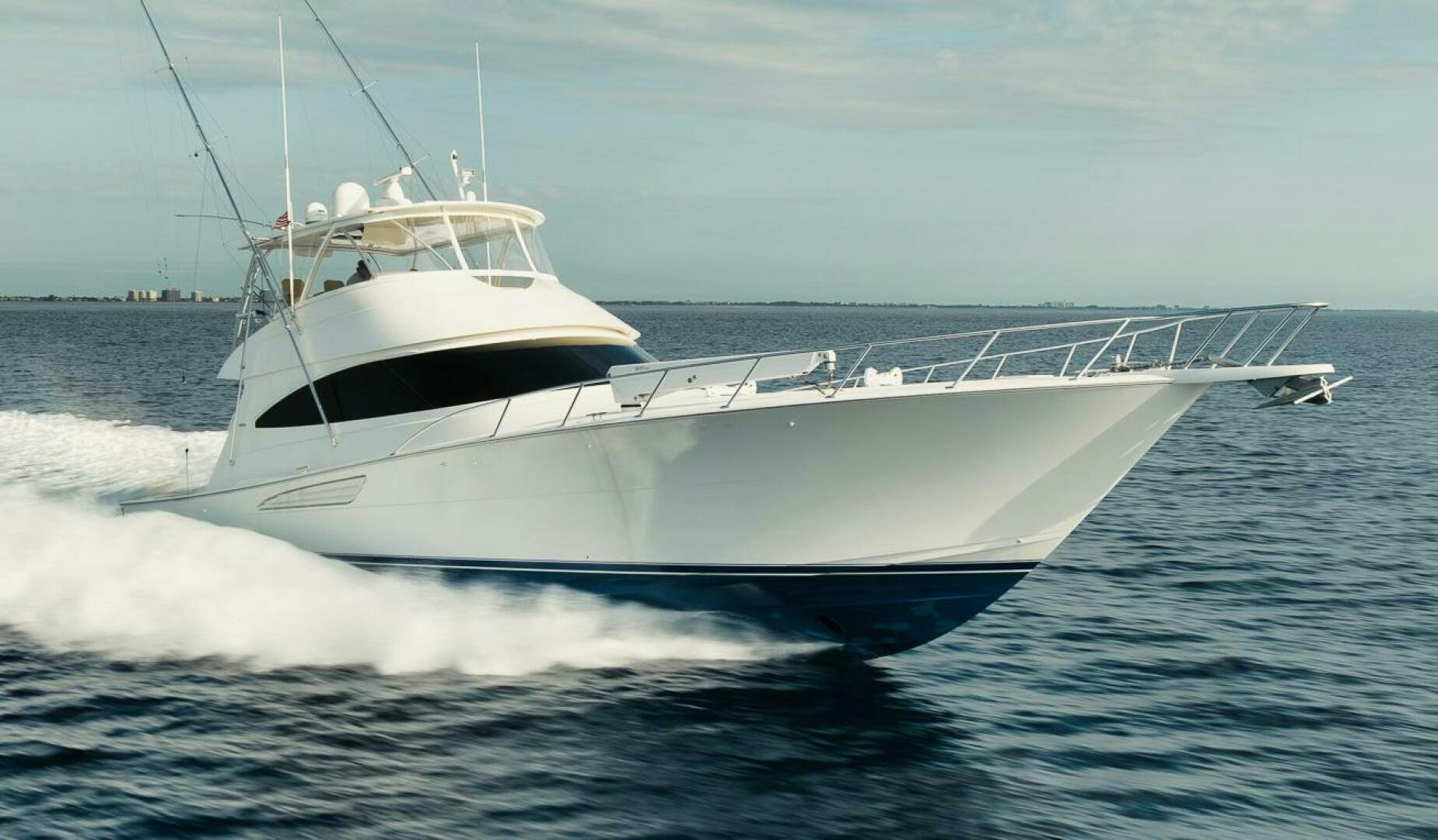 a white yacht on the water aboard WHY KNOT Yacht for Sale