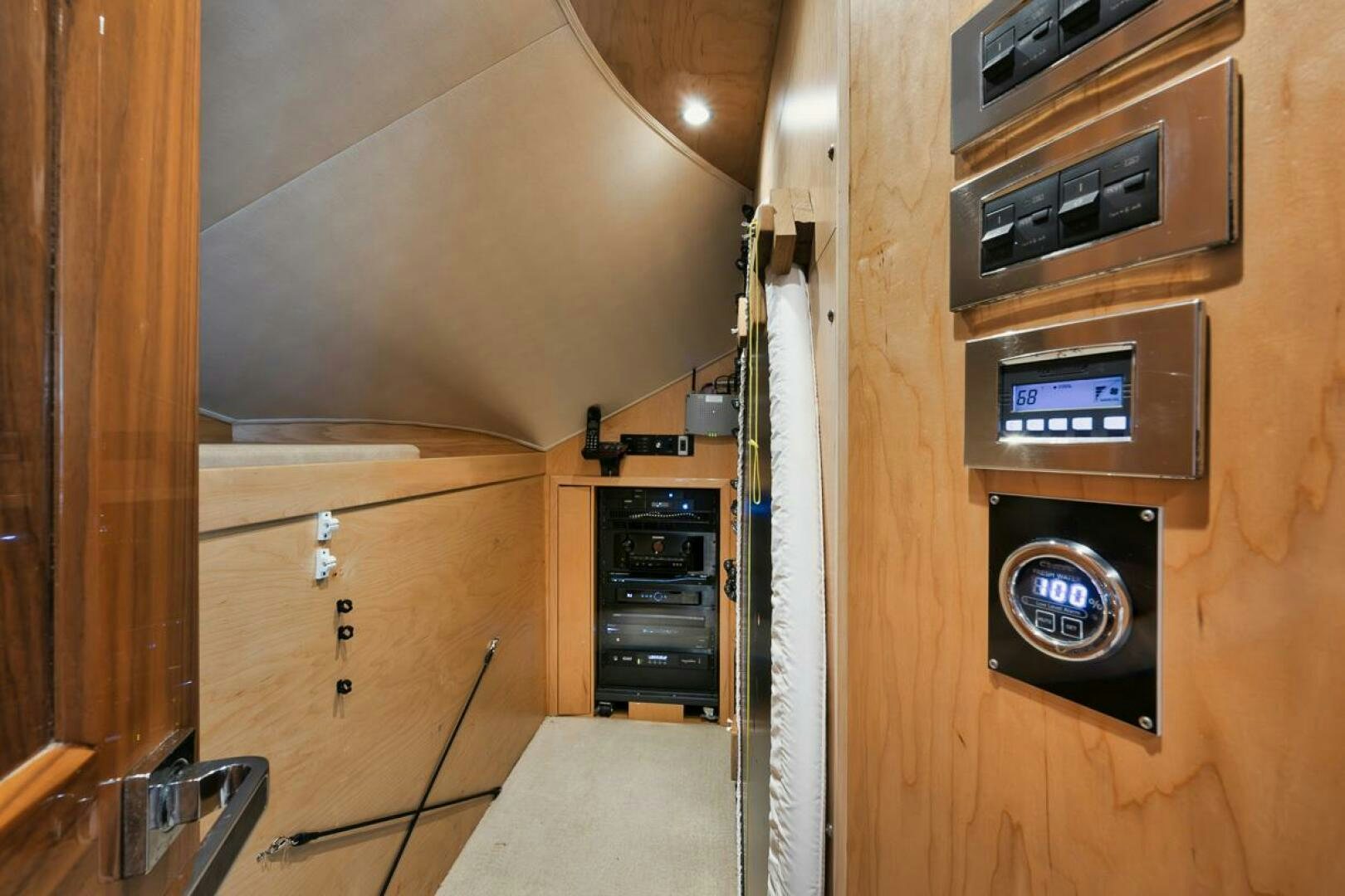 a room with a wood paneled wall and a door with a vent aboard WHY KNOT Yacht for Sale