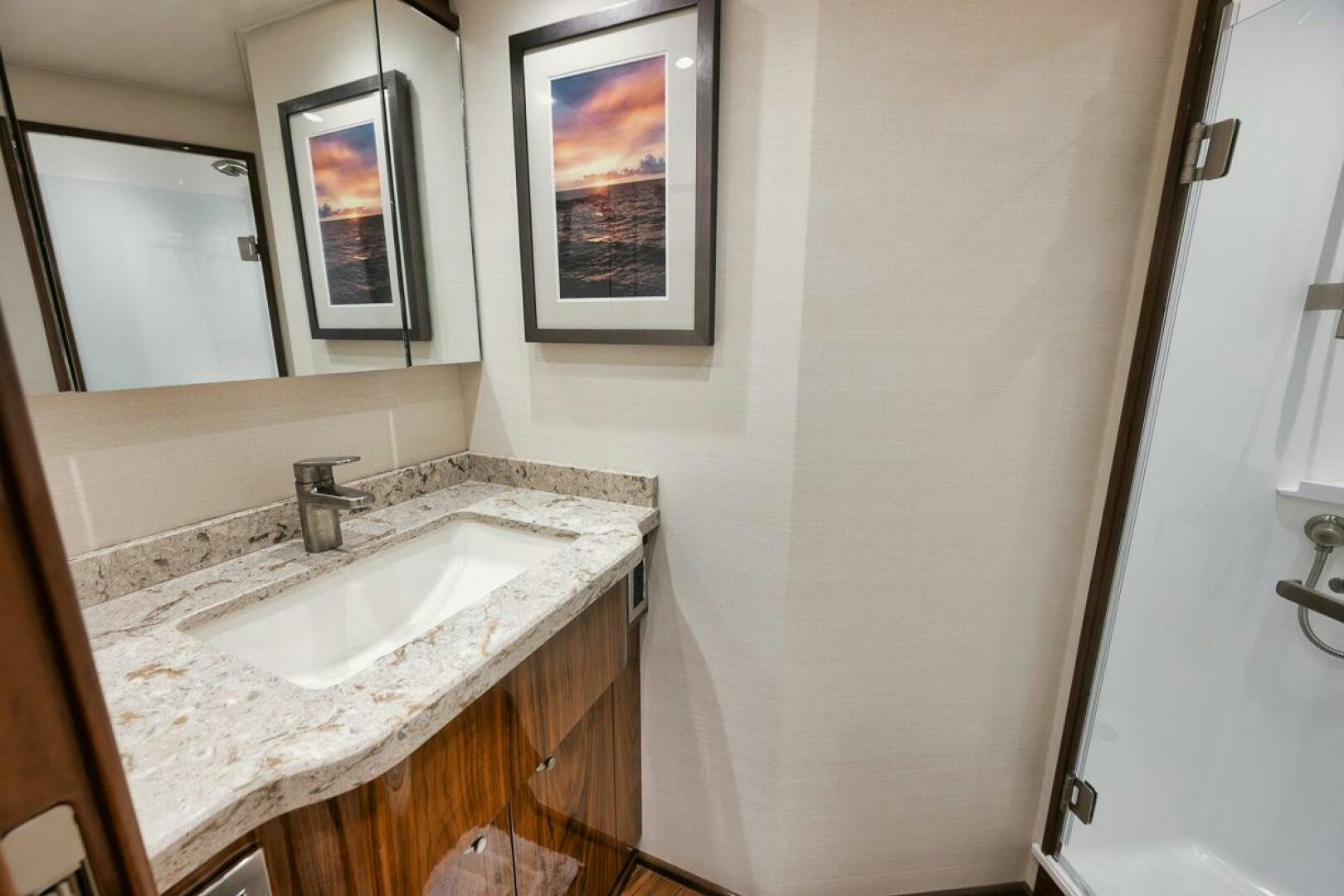 a bathroom with a sink and a mirror aboard WHY KNOT Yacht for Sale