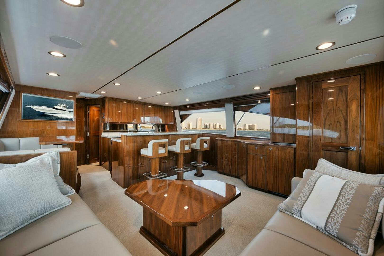 a living room with a wood table aboard WHY KNOT Yacht for Sale