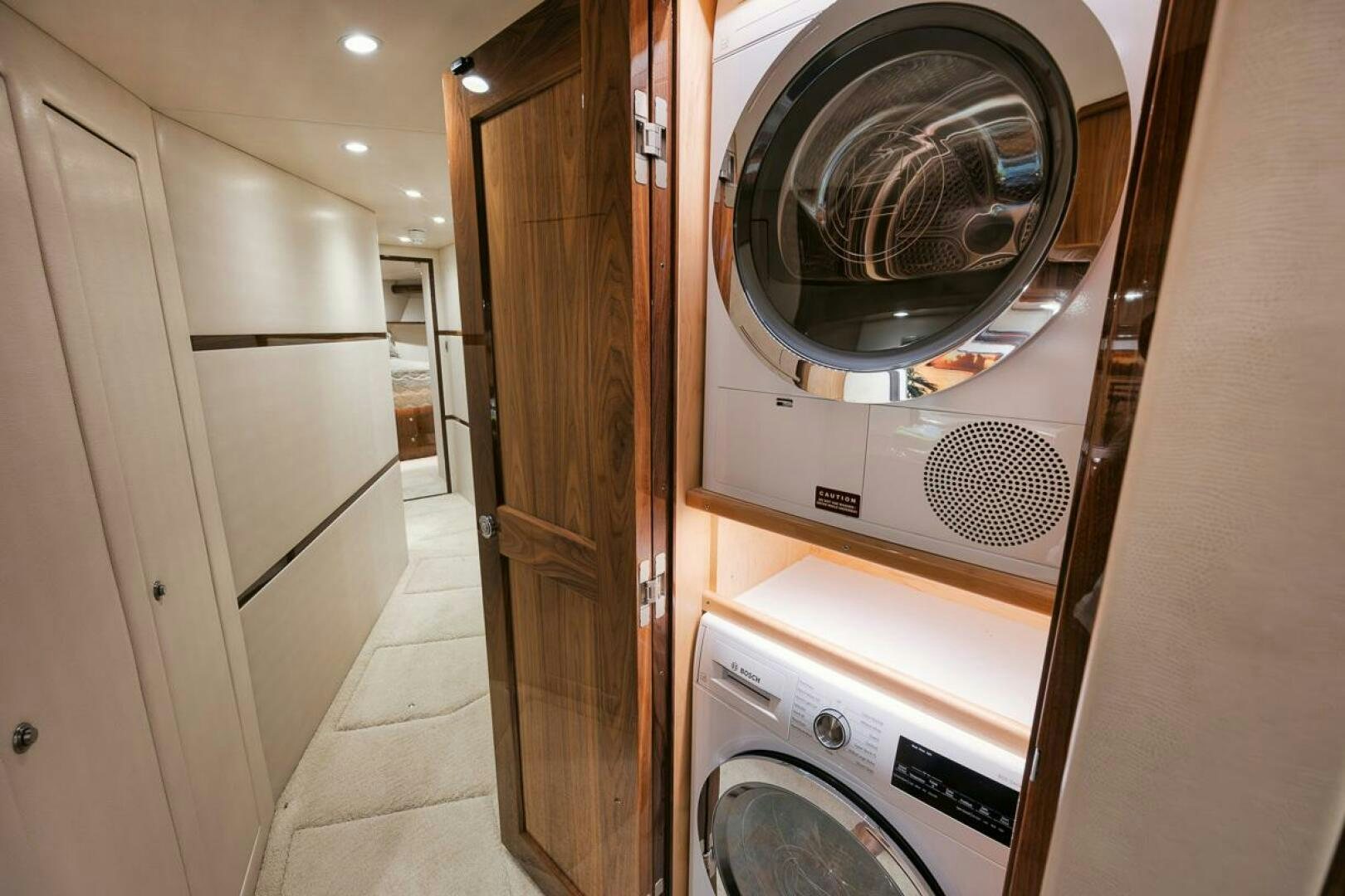 a laundry room with washing machine aboard WHY KNOT Yacht for Sale