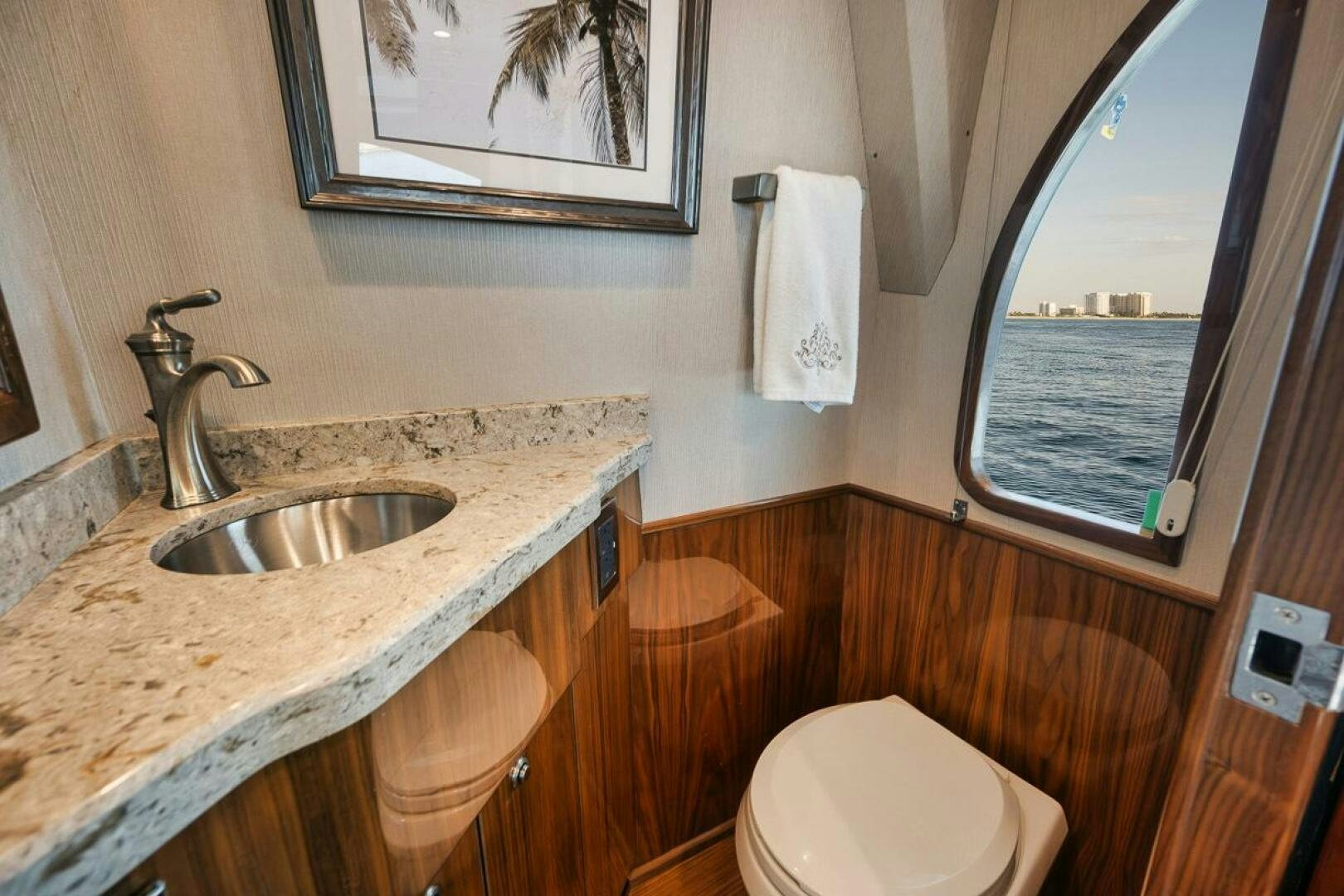 a bathroom with a sink and a toilet aboard WHY KNOT Yacht for Sale