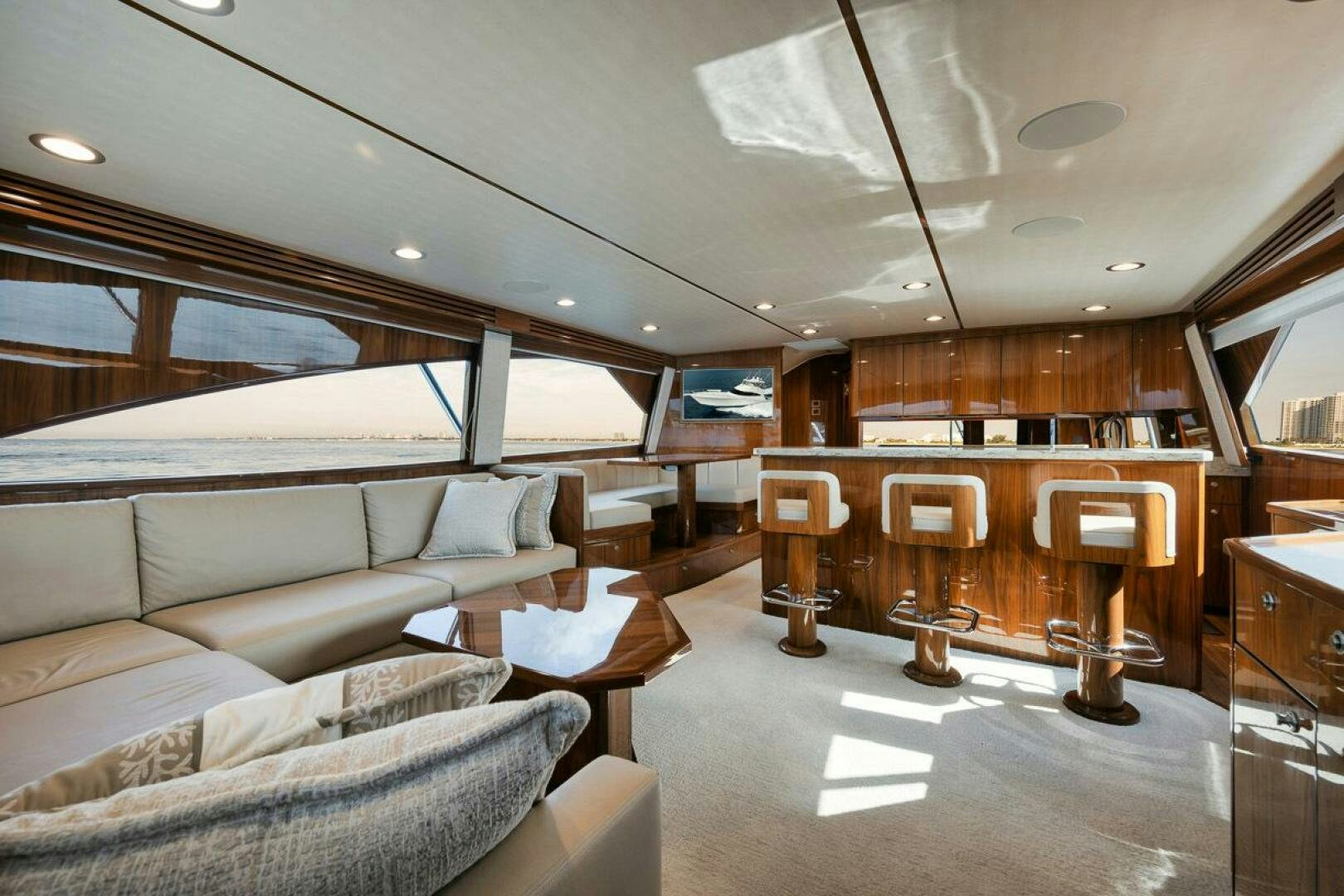 a living room with a couch and a piano aboard WHY KNOT Yacht for Sale