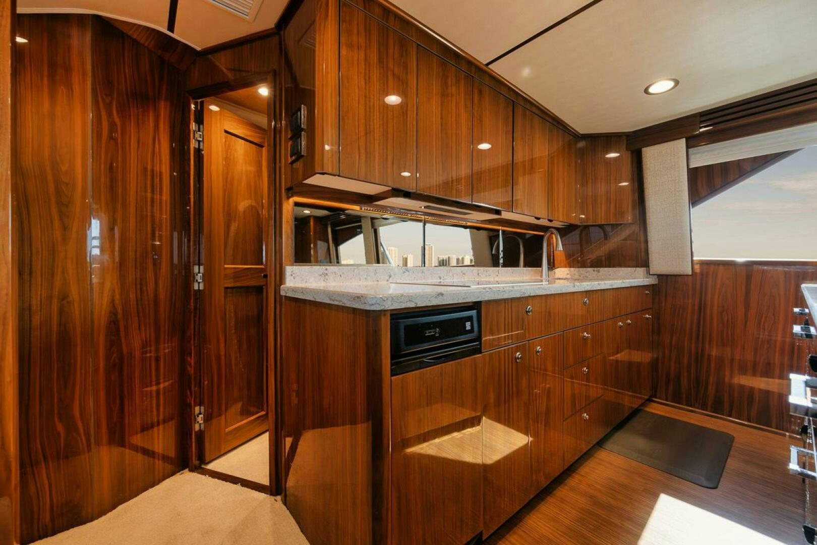 a kitchen with wooden cabinets aboard WHY KNOT Yacht for Sale