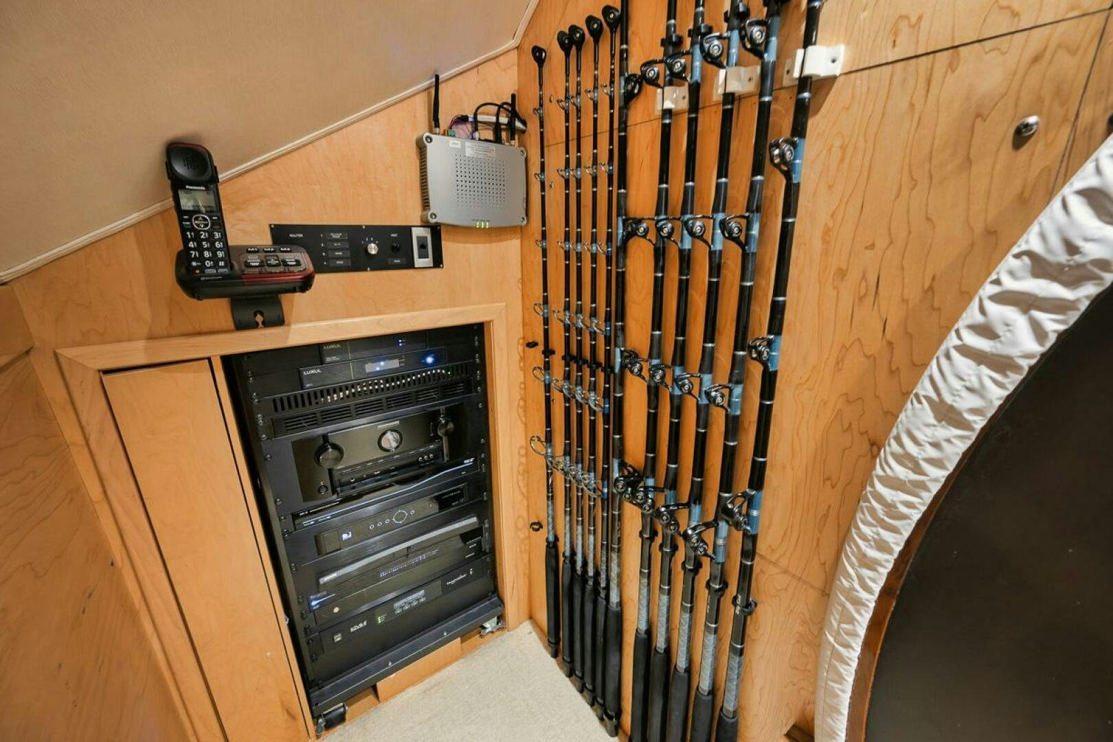 a shelf with electronic devices aboard WHY KNOT Yacht for Sale