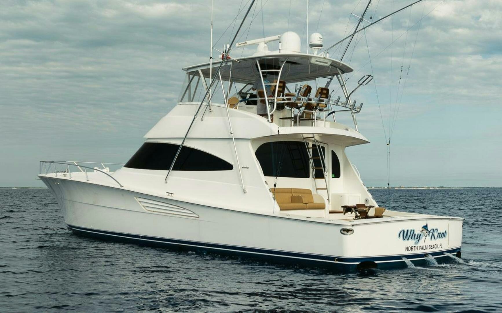 a white yacht in the water aboard WHY KNOT Yacht for Sale