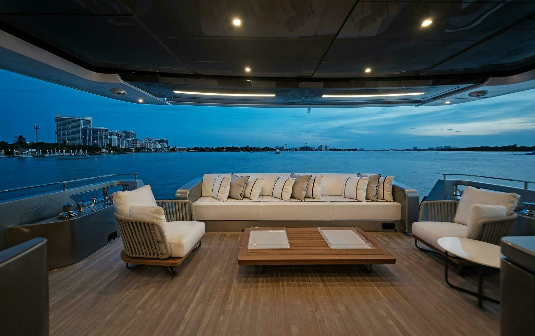 a room with a couch and a table and a large window aboard ALEGRA Yacht for Sale