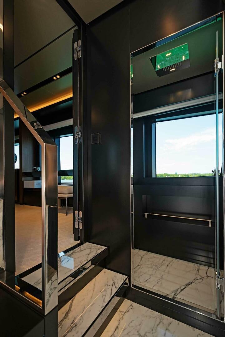 a hallway with glass doors aboard ALEGRA Yacht for Sale